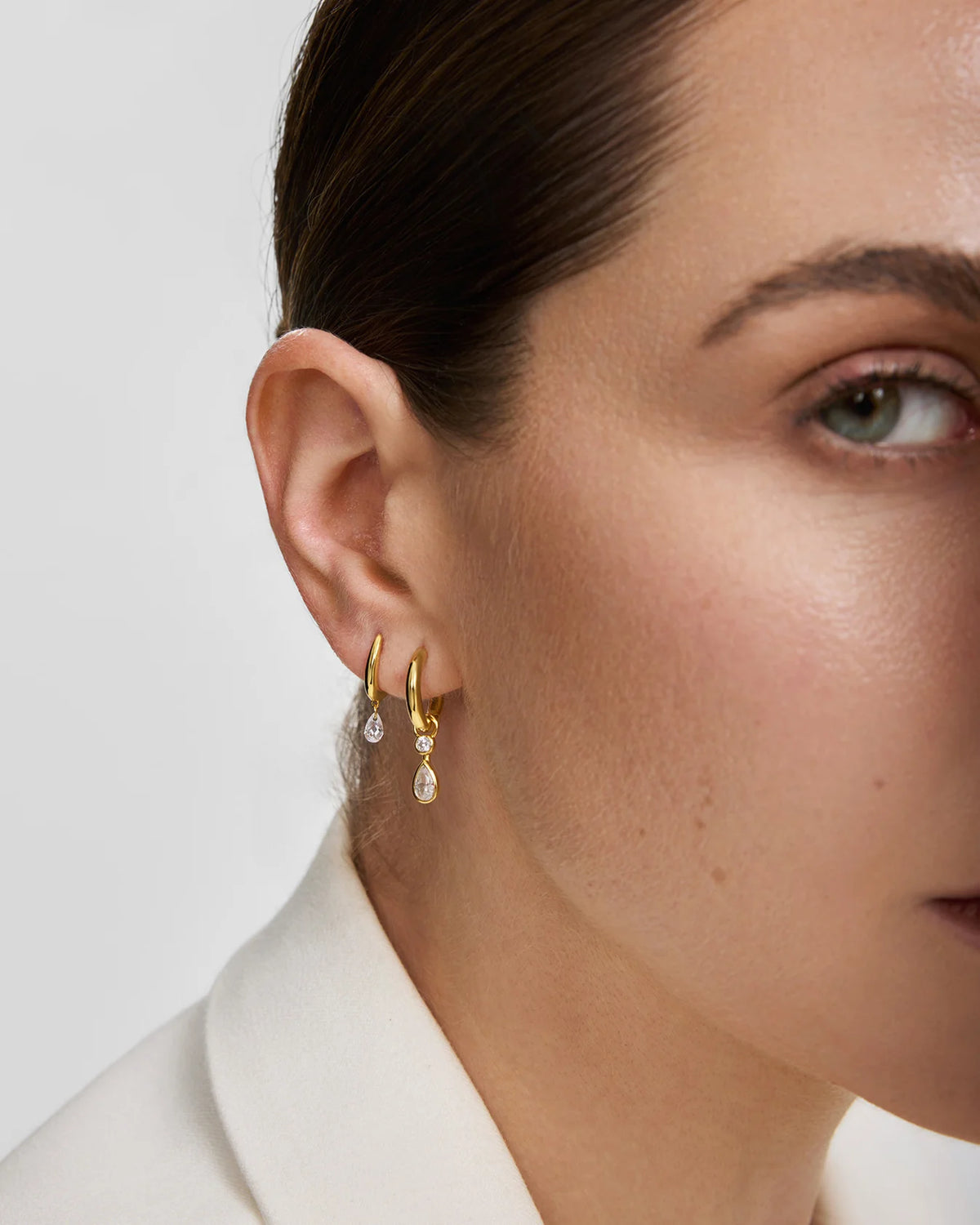 WANDERER DANGLING TEARDROP HUGGIE HOOP EARRINGS
