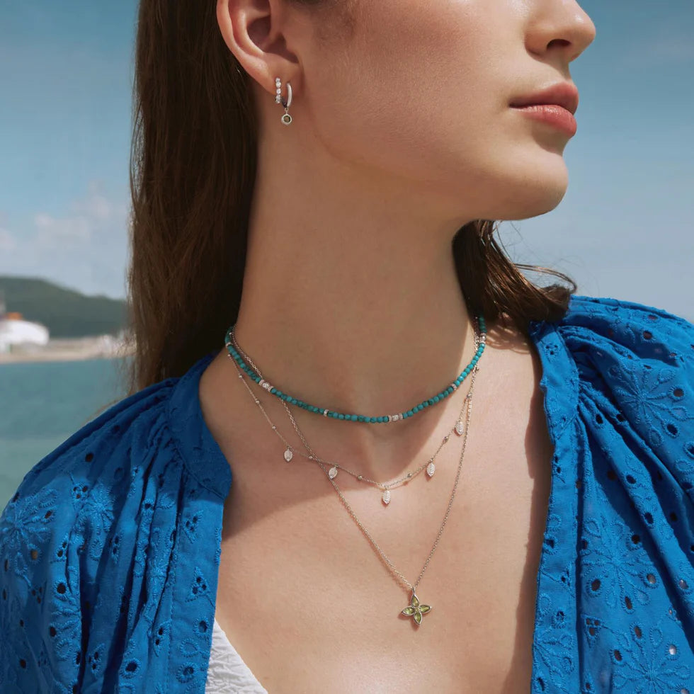 LUNA TWISTED HUGGIE HOOP EARRINGS